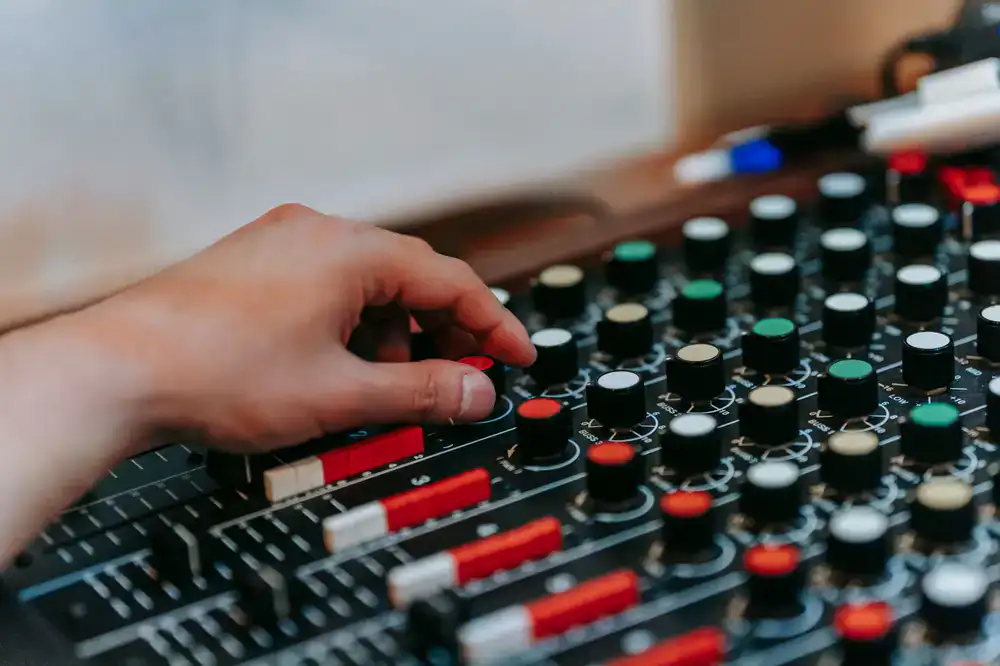 Lukas Varga adjusting a mixing console